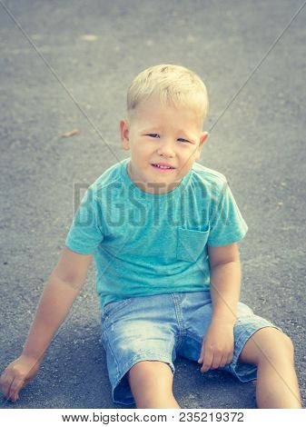 Cute doing exercises . Child outdoor activity