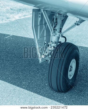 Wheel Of Airplane. Close Up Of Aircraft Wheel On Runway. Plane Wheel, Jet Plane, Blue Colored
