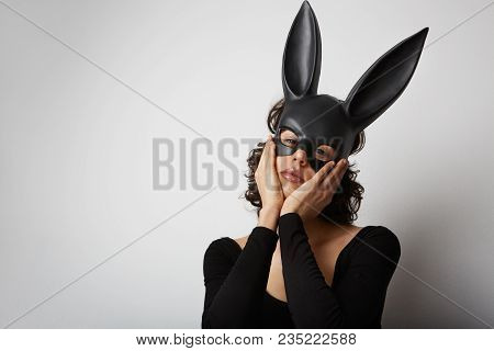 Sexy Beautiful Woman Posing In Lace Lingerie And Black Bunny Mask On White Background. Isolated.