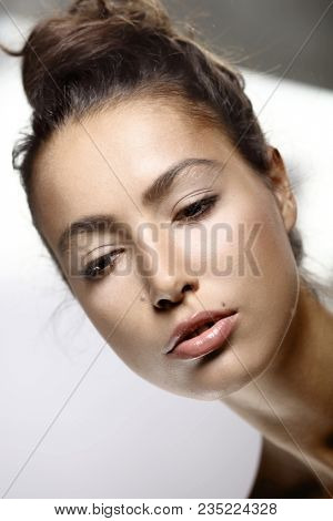 Closeup portrait of attractive young woman.