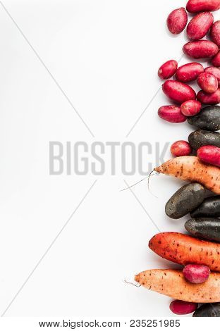 Different Varieties In Form And Color Of Potatoes  On A White Isolated Background. Red, Shetland Bla