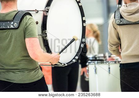 Musicians March, Play And Make Music With Large Bass Drums