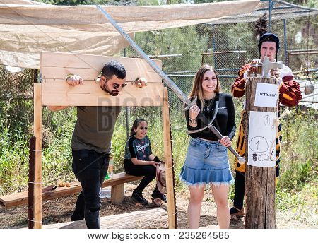 Goren, Israel, April 06, 2018 : A Visitor Of A Knight Festival Poses Shackled With An Executioner In
