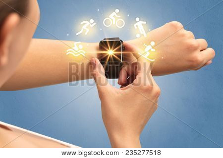 Female hand with smartwatch and sport concept.