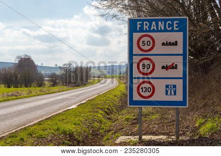 Road Sign Of Return To The French Territory With Different Speed Limits Along The Roads.