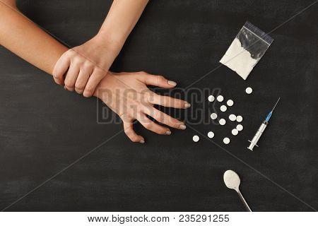 Drug Addict Hands On Dark Table