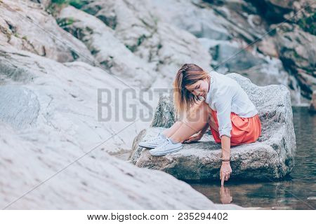 Beautiful Young Woman Relaxing In The Nauture On The Spring Day