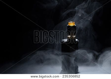 Vape Close-up In A Smoke On A Black Background