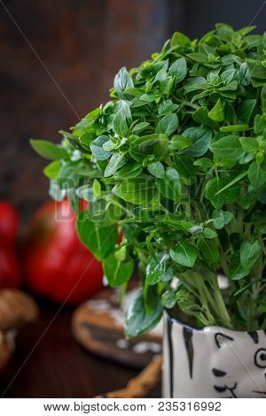 Bazil Leaves On Kitchen Over Wooden Table