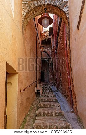 Stairs And Passageway Under A Street Lamp
