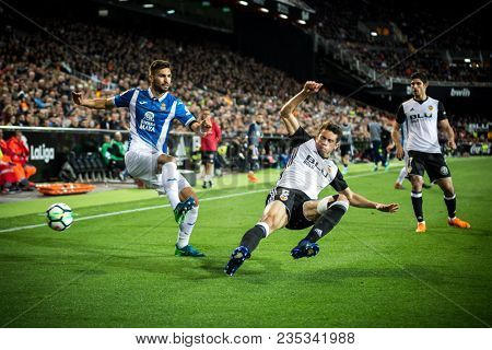 VALENCIA, SPAIN - APRIL 8: (L) Navarro, Paulista during Spanish La Liga match between Valencia CF and RCD Espanyol at Mestalla Stadium on April 8, 2018 in Valencia, Spain
