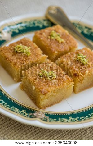 An authentic middle eastern dessert - Basbousa, a cake made with semolina and sugar syrup.