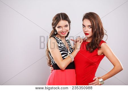 Two young beauty women standing together . Two young beauty wome