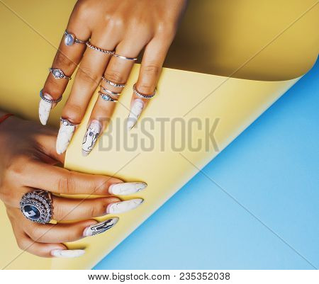 Woman Hands Holding Colorful Paper Copyspace Wearing A Lot Of Oriental Jewelry Rings,  Indian Girl C