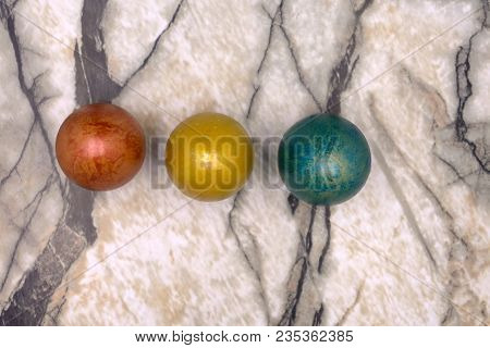 Colorful Bright Easter Little Eggs Lined Up In The Middle Of Picture, Made Of Plasticine On Wooden B
