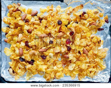 Crunchy Caramel Conflakes With Almonds, Cashew Nuts, Pumpkin Seeds And Dried Cranberries On A Tray. 