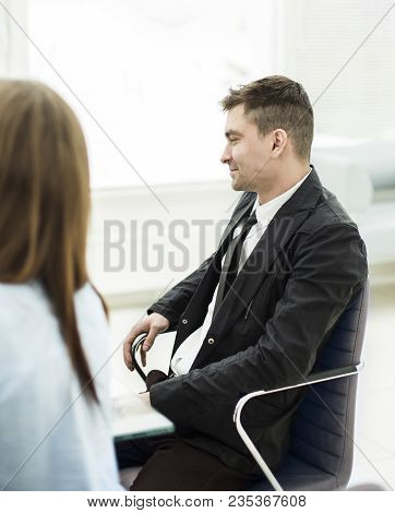 Photo Successful Employee Sitting Behind A Desk In The Office . The Photo Has A Empty Space For Your
