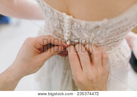 Close Up Morning Preparation Newlyweds For The Wedding. Men's Hands Button Up Elegant Lace Delicate 