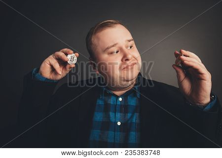 Golden Bitcoin In Fat Businessman Hand, Digitall Symbol Of New Virtual Currency