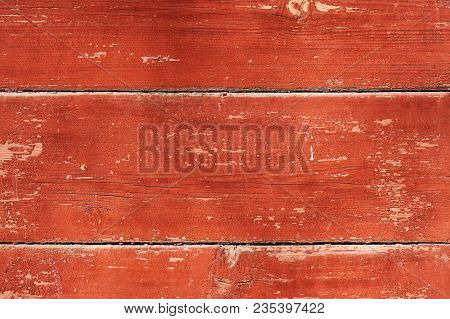 Old Wooden Background Painted With Red Paint With A Texture Of Cracks And Scratches. Red Background