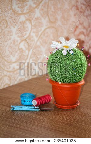 Cactus As A Handmade Needle Bed On Table. Sewing Accessories, Colored Spools Of Thread