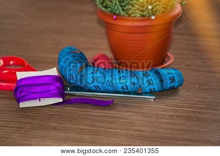 Sewing Accessories On Table, Colored Spools Of Thread