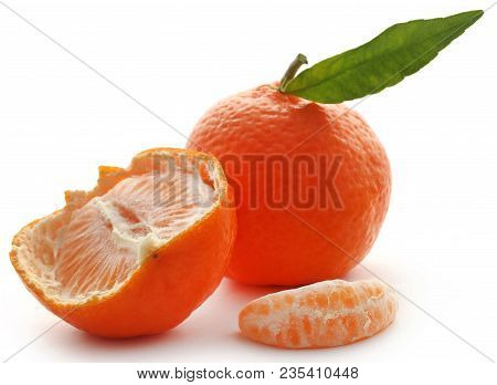 Fresh Orange With Green Leaf Over White Background
