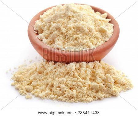Gram Flour In Bowl Over White Background