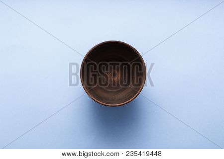 Empty Brown Plate On Pastel Blue Background, Top View, Flat Lay