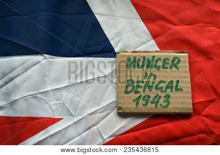 British history.History of genocide. The famine in in Bengal 1943. Concept.British Flag background. April 9, 2018 in Kiev,Ukraine