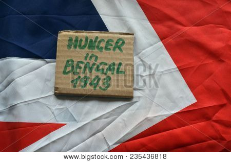British history.History of genocide. The famine in in Bengal 1943. Concept.British Flag background. April 9, 2018 in Kiev,Ukraine