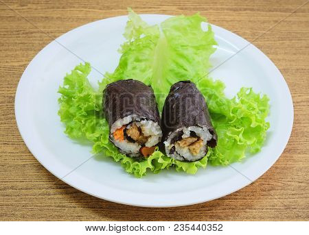 Japanese Cuisine, Traditional Vagetarian Japanese Rice Maki Sushi Roll Stuff With Tofu And Carrot Wr