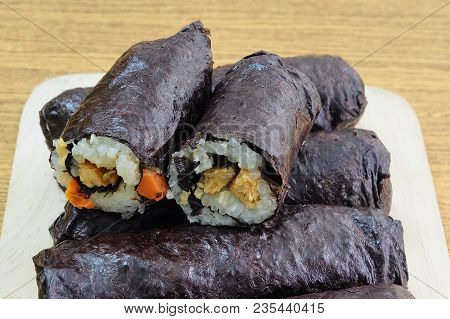 Japanese Cuisine, Traditional Vagetarian Japanese Rice Maki Sushi Roll Stuff With Tofu And Carrot Wr