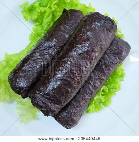 Japanese Cuisine, Top View Of Traditional Unsliced Japanese Rice Maki Sushi Roll With Nori Seaweed S