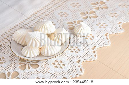 White Meringue On A Lacy Cloth. Still Life.