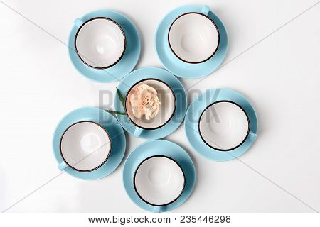 Clean Coffee Or Tea Set. Plenty Of Elegant Porcelain Light Blue Cups And Saucers At White Isolated B
