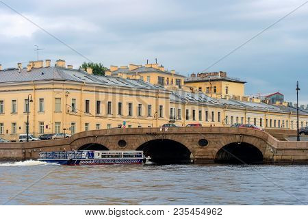 Russia, Saint Petersburg - August 18, 2017: Pleasure Boat Comes From The River Neva Under The Prache