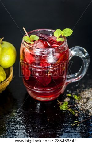 Close Up Of Popular Indian Shrabat Of Guava With Sugar And Masala In A Glass With Raw Fresh Guava On