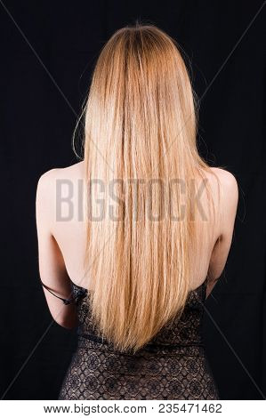 Back View Of Young Sexy Girl In Black Lace Body And Blonde Hair Isolated On Black. Elegant Woman Und