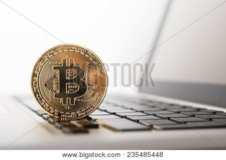 Golden Bitcoin - New Virtual Money On Notebook. A Visual Representation Of Digital Cryptocurrencies.