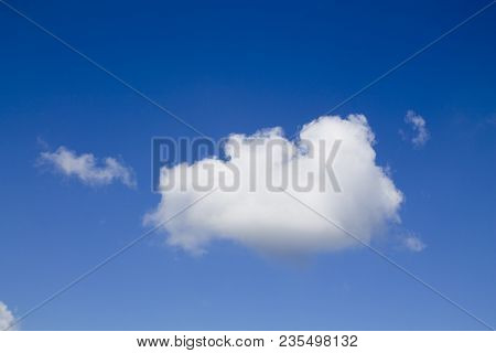 Small White Cloud On A Blue Sky