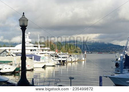 Vancouver Harbour And Mount Fromme In A Cloudy Day, Vancouver, British Columbia, Canada.