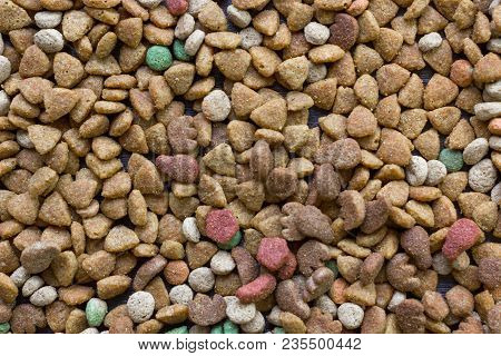 Dry Pet Food Background - A Lot Of Pieces Of Food In Flat Position.