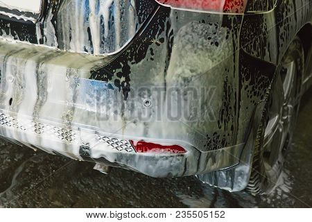 Car Covered With Foam On Car Wash