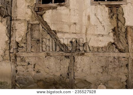 Stone Wall With Stone, Wood And Mud Background
Rustic Wall In A Old Construction With Stone, Wood An