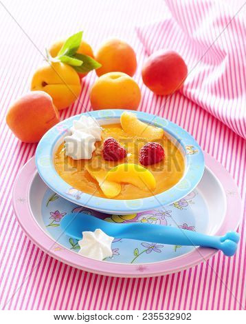 Creamy Purred Fresh Apricot Soup With Raspberry.