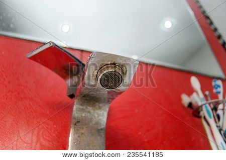 Solid Water And Rust On The Washbasin In The Bathroom