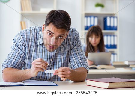 Students sitting and studying in classroom college