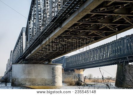Bridge Crossing Across A Large River. Truss Bridge In The City Of Tczew In Poland.