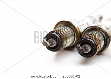 Heavily  Worn Spark Plugs Isolated On White